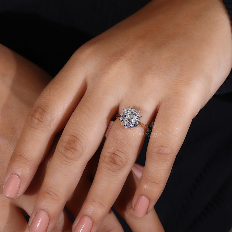 Round cut diamond ring set in yellow gold elegance.
