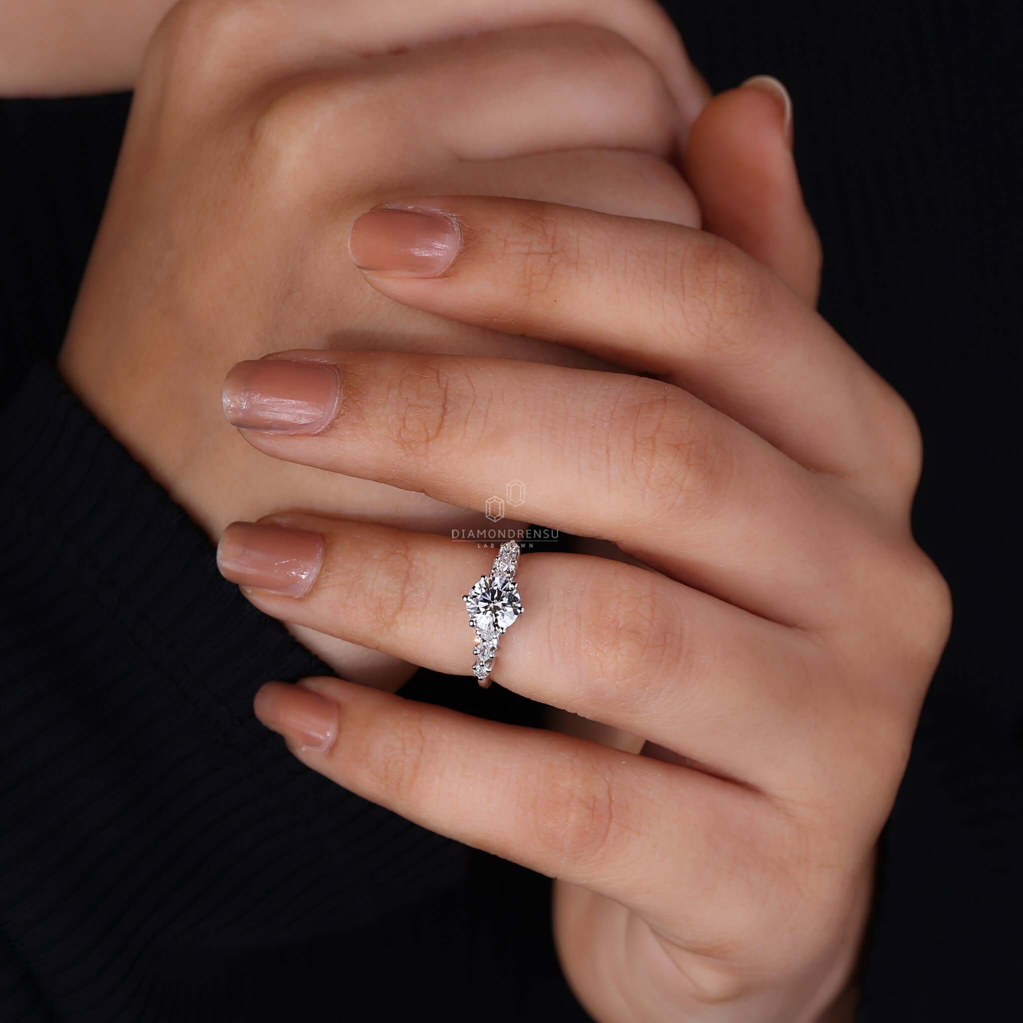 Hand gracefully showcasing a simple engagement ring, focusing on its refined and elegant style.