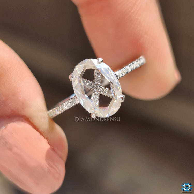 A white gold engagement ring provides a sleek, polished finish.
