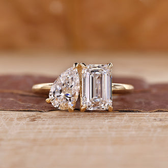 Toi et moi gold ring with pear and emerald cut diamonds.
