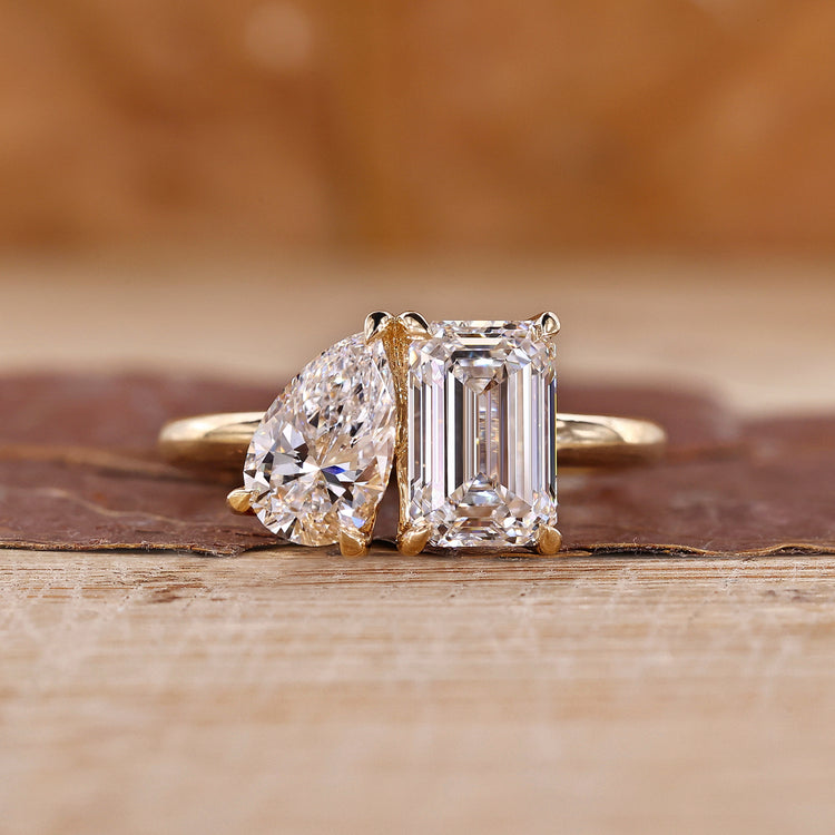 Toi et moi gold ring with pear and emerald cut diamonds.
