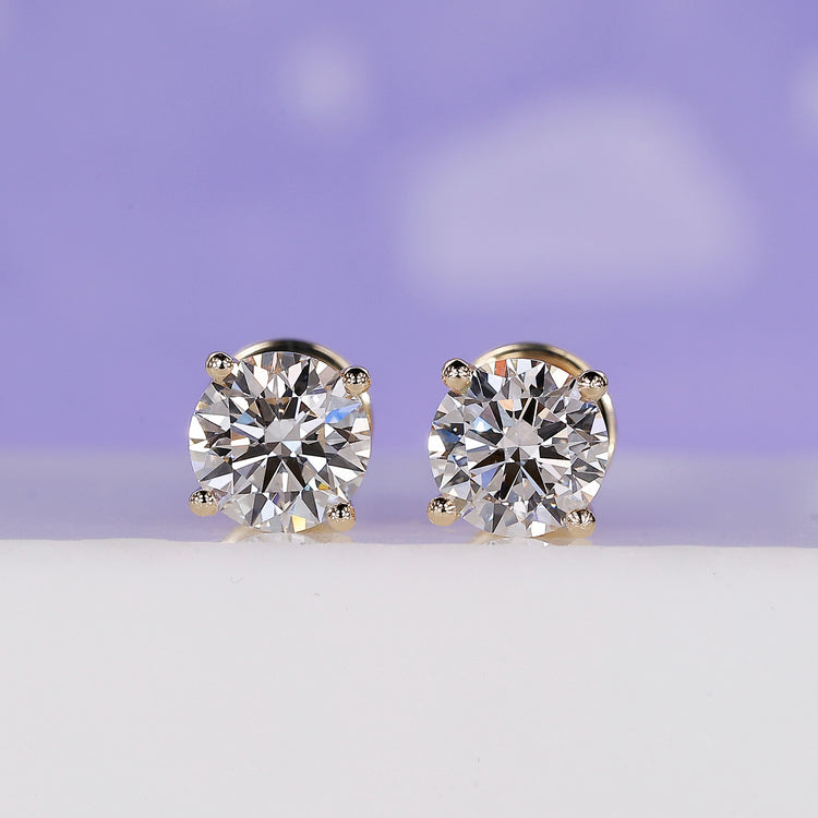 Elegant yellow gold and diamond earrings for timeless style.
