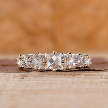 7 Stone Diamond Band in yellow gold with French cut diamonds.
