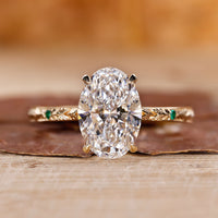 Oval hidden halo engagement ring with a sparkling center diamond.

