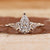 Three Stone Engagement Ring with stunning diamond accents.