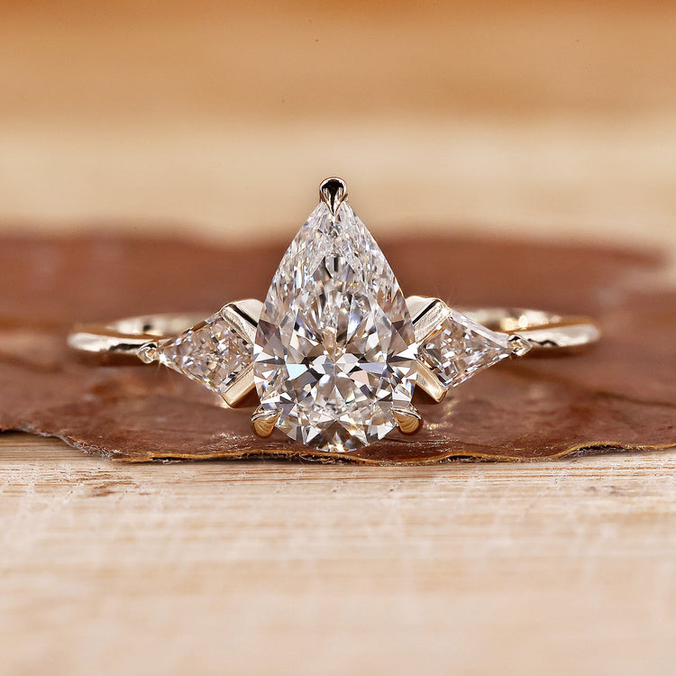 Three Stone Engagement Ring with stunning diamond accents.
