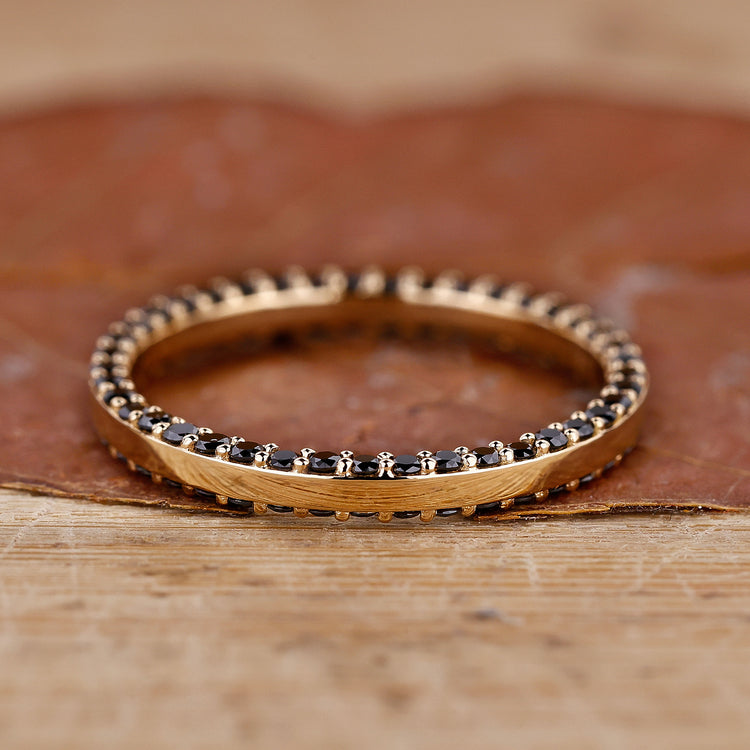 Handmade jewelry featuring a sleek eternity wedding band.
