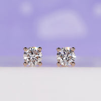 Rose Gold Diamond Stud Earrings with 0.70 TCW for timeless elegance.
