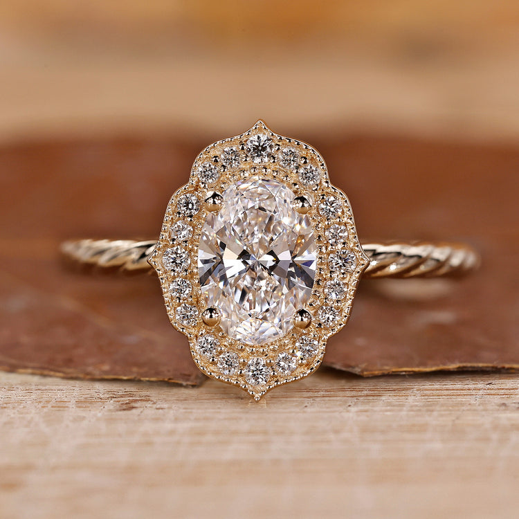 Vintage oval diamond ring with intricate detailing.
