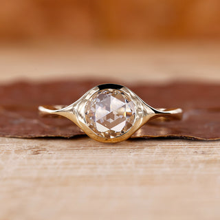 Round rose cut diamond ring with a stunning bezel setting.
