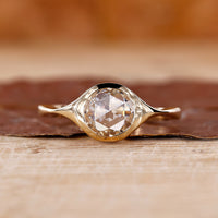 Round rose cut diamond ring with a stunning bezel setting.
