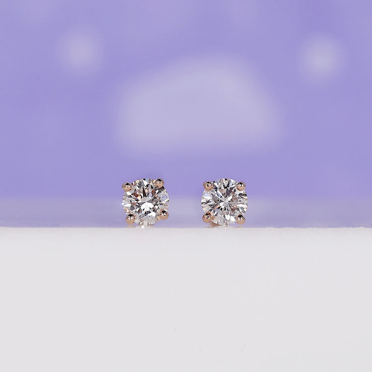 Round Diamond Stud Earrings 0.36 TCW with a classic design.
