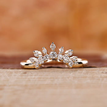 Tiara wedding band with a delicate round diamond design.
