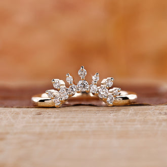 Tiara wedding band with a delicate round diamond design.
