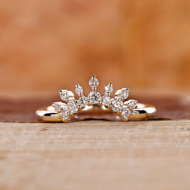 Tiara wedding band with a delicate round diamond design.
