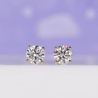 Stunning round diamond earrings crafted for timeless elegance.
