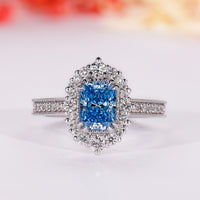 Radiant cut blue diamond ring with vintage halo engagement ring
