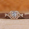 Halo diamond engagement ring with Jubilee cut diamond and twisted pave setting.
