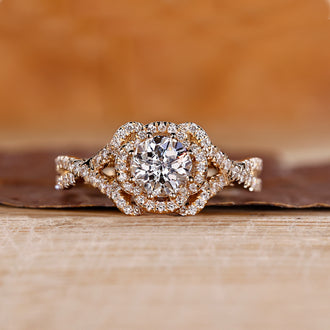 Halo diamond engagement ring with Jubilee cut diamond and twisted pave setting.

