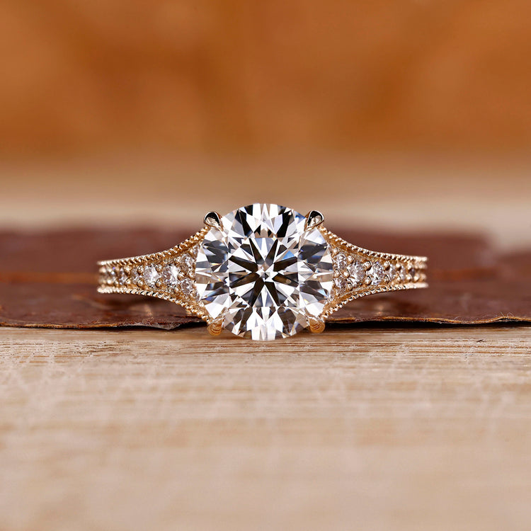 Round cut diamond ring with tapered pave setting.
