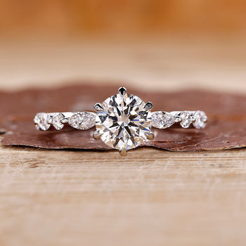 Round cut diamond ring in a classic white gold design.
