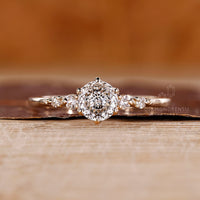 Lab grown Portuguese cut diamond ring with round side stones.
