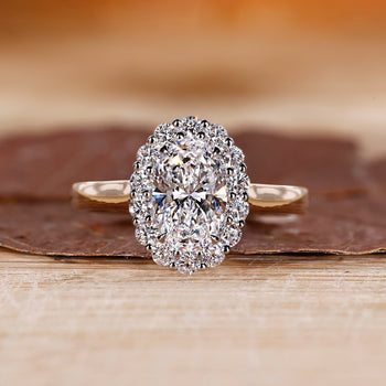 Oval diamond ring set in a white gold band with claw prong setting by Diamondrensu
