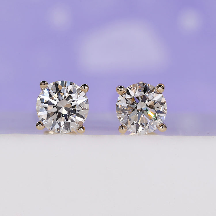 Classic round diamond stud earrings crafted for timeless style.
