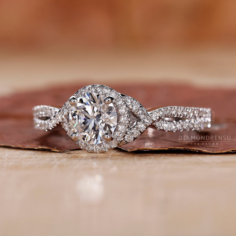 A stunning twisted halo engagement ring featuring a unique and elegant twist.
