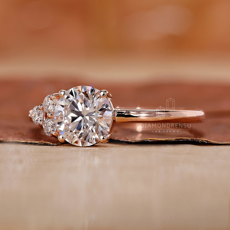 A rose gold round diamond engagement ring with intricate details.
