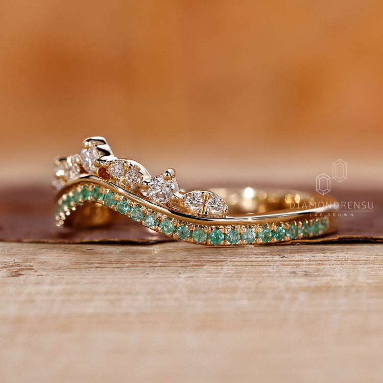 Unique green Emerald wedding band showcasing a vibrant gemstone for a bold look.