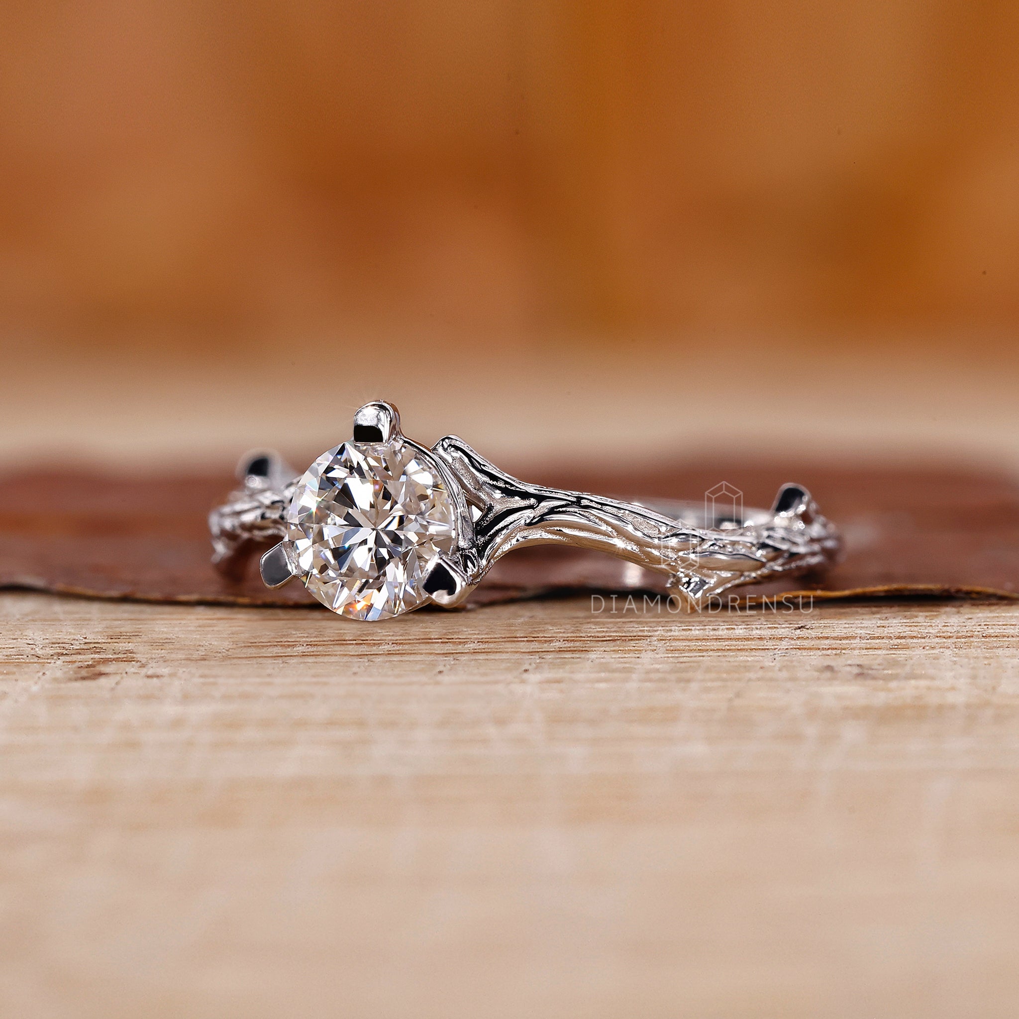 Elegant diamondrensu engagement ring featuring a round solitaire diamond, crafted with a nature-inspired white gold band