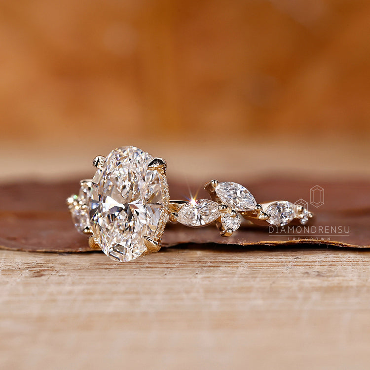 Hidden halo ring in yellow gold with side stones for added brilliance.