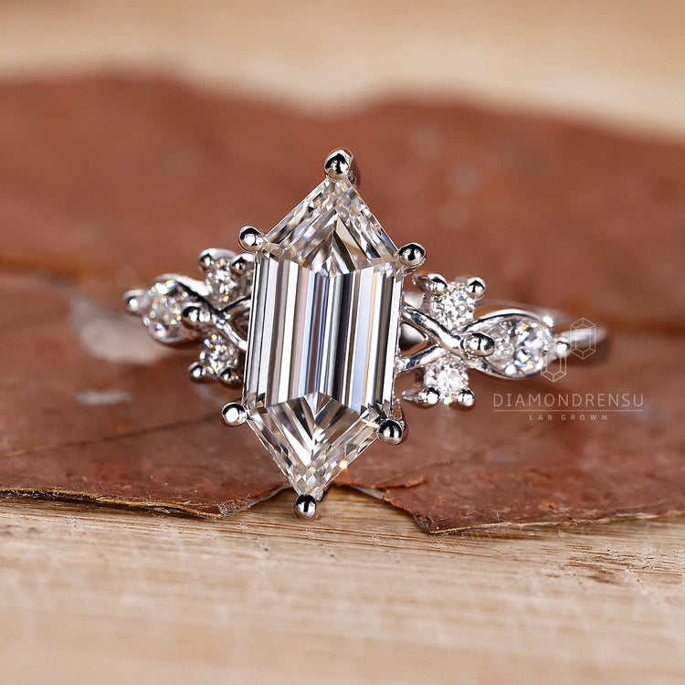 Elongated hexagon diamond engagement ring design.