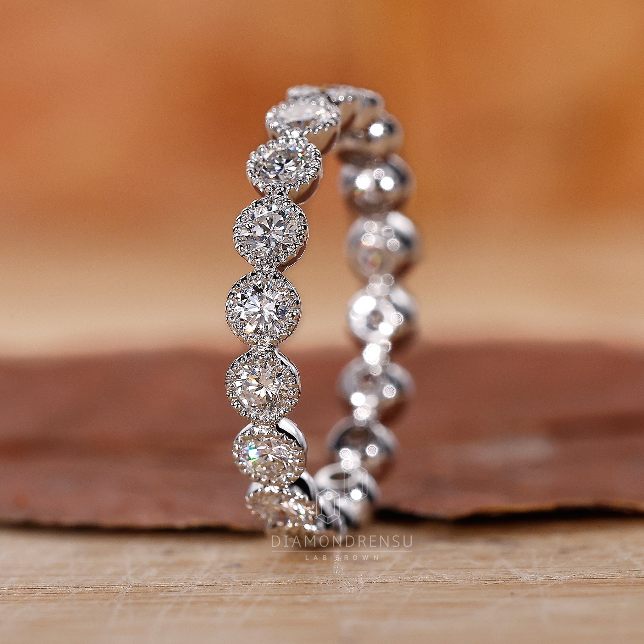 White Gold Wedding Band featuring bezel set diamonds.
