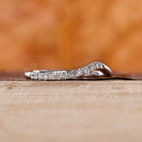 White gold wedding band with a modern chevron shape.
