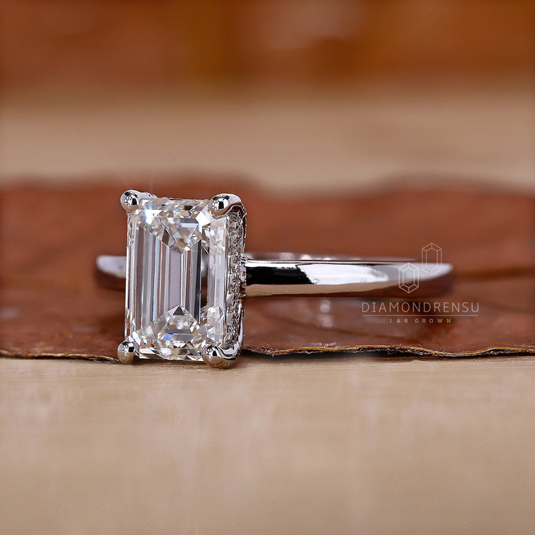White Gold Engagement Ring with an emerald cut diamond.
