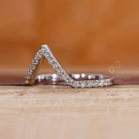 Prong set wedding band offering secure and stylish brilliance.
