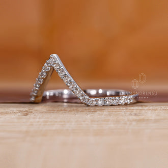Prong set wedding band offering secure and stylish brilliance.
