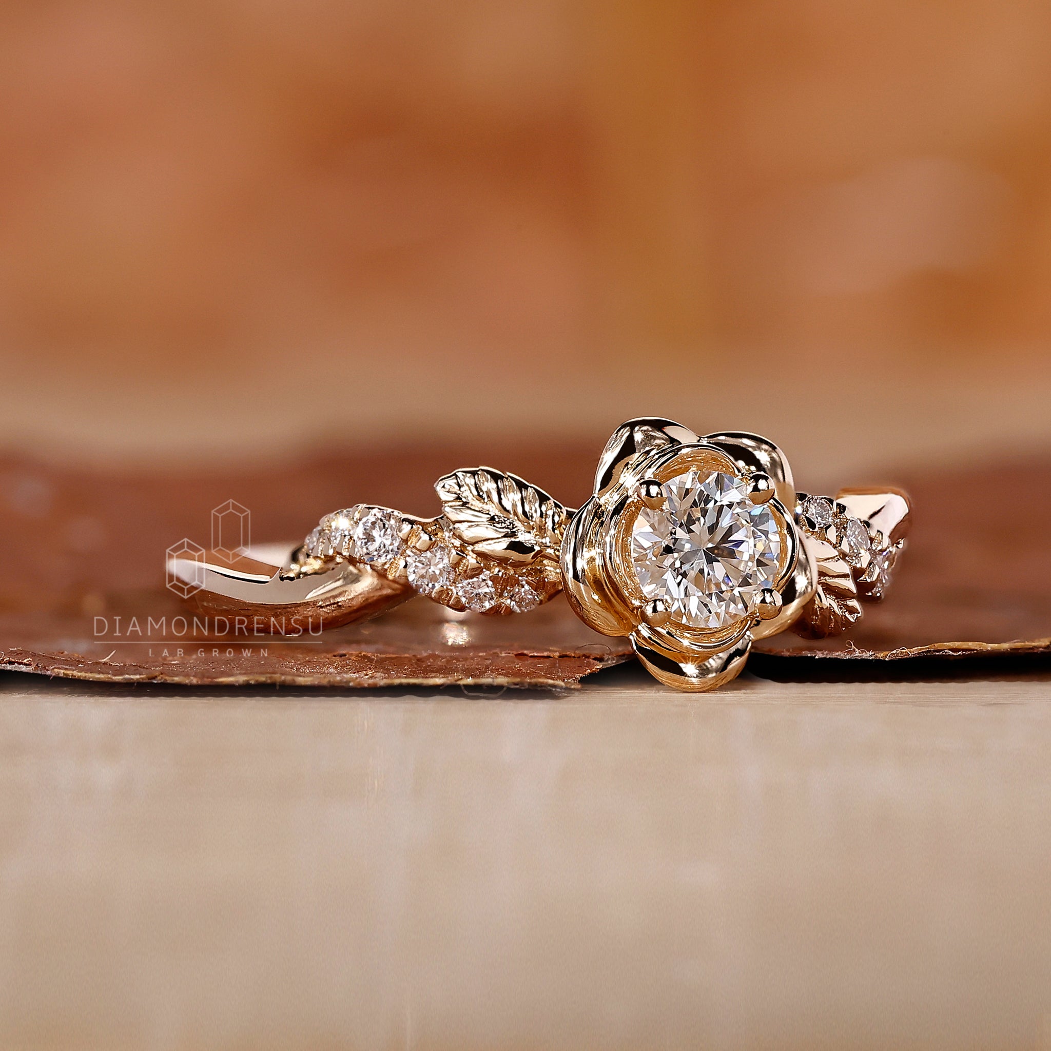 Diamondrensu nature-inspired engagement ring with a round diamond set in yellow gold