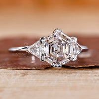 Bezel setting ring with hexagon diamond and custom design.
