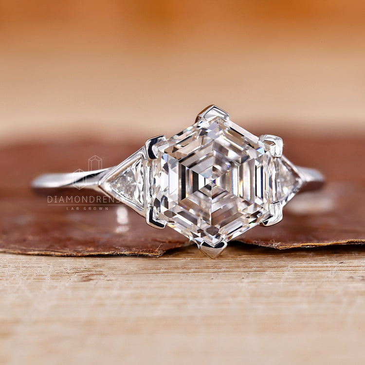 Bezel setting ring with hexagon diamond and custom design.
