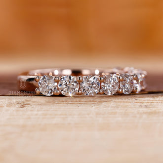 Prong setting wedding band showcasing secure and stylish diamonds.
