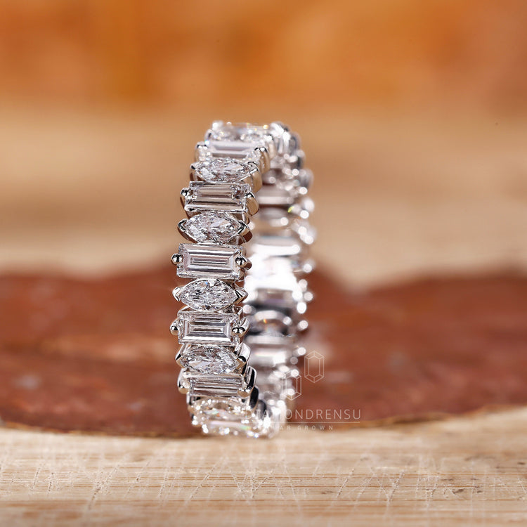 Prong set wedding band showcasing brilliant diamonds.
