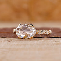 Oval ring with hidden halo, set in a double claw prong for added brilliance.
