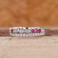 White gold wedding band with custom design and round diamonds.
