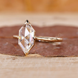 Marquise engagement ring in yellow gold.