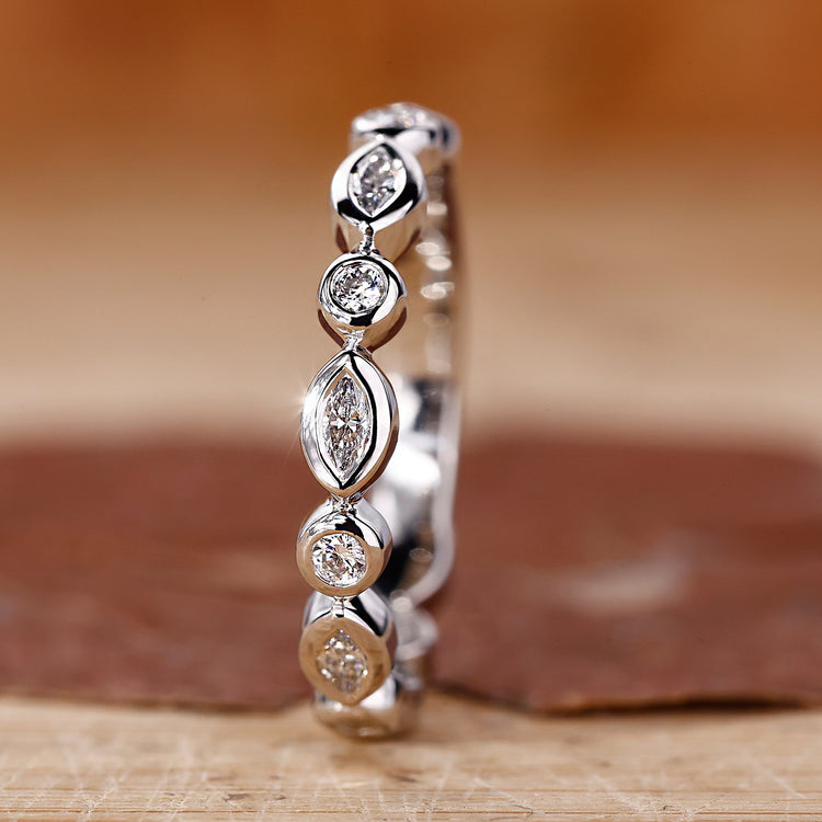 Round and marquise wedding band with a sleek finish.
