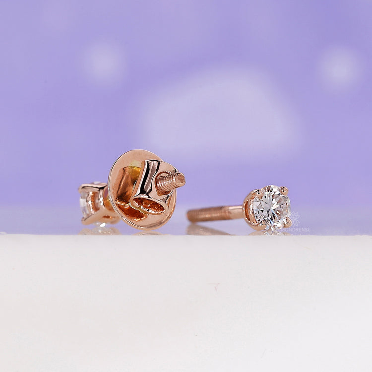 Stylish studs earrings for women in rose gold diamond design.
