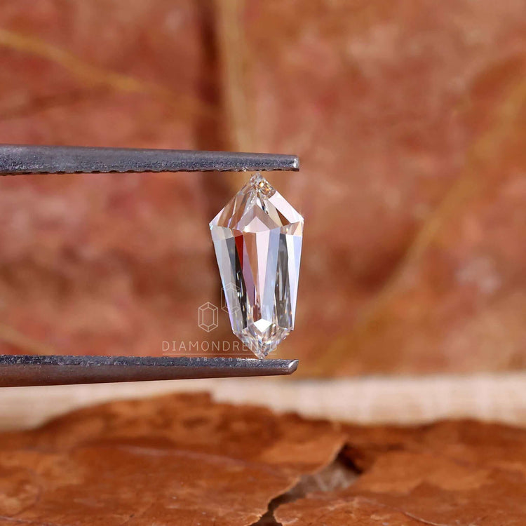 Lab grown diamond featured in diamond shape shield style.
